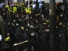 Police officers try to enter as the members of the ruling People Power Party try to block them in front of the gate of the presidential residence in Seoul, South Korea, Wednesday, Jan. 15, 2025. (AP Photo/Lee Jin-man)