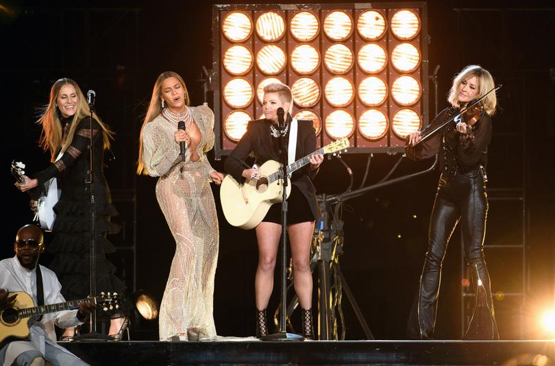 Carrie Underwood (pictured with Beyonce and The Chicks) will perform at Mr Trump’s inauguration. 