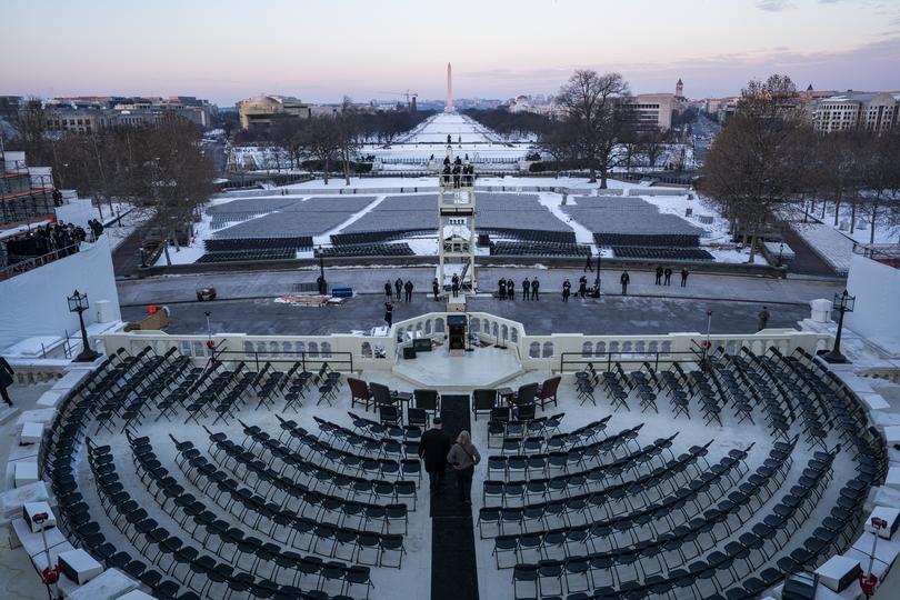 The sun rises on the National Mall during a presidential inauguration rehearsal on Capitol Hill on Sunday in Washington.