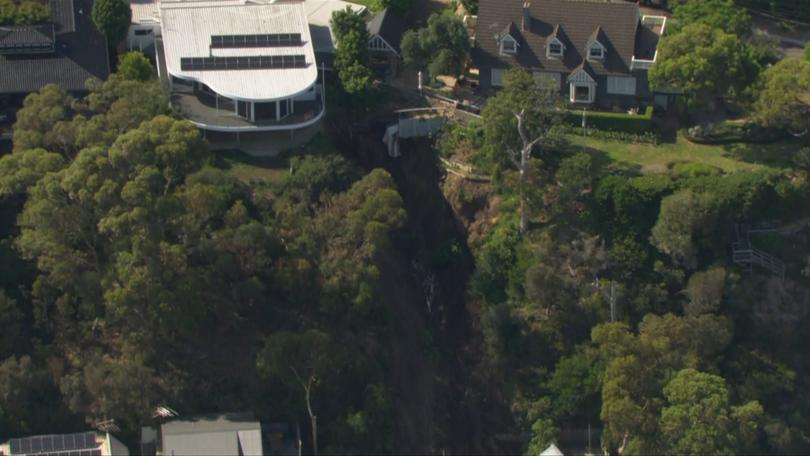 The home slid 50m onto the street below.