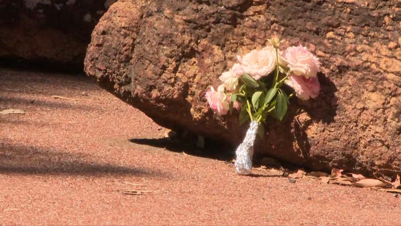 Flowers have been laid at the lake as a tribute to the boy.