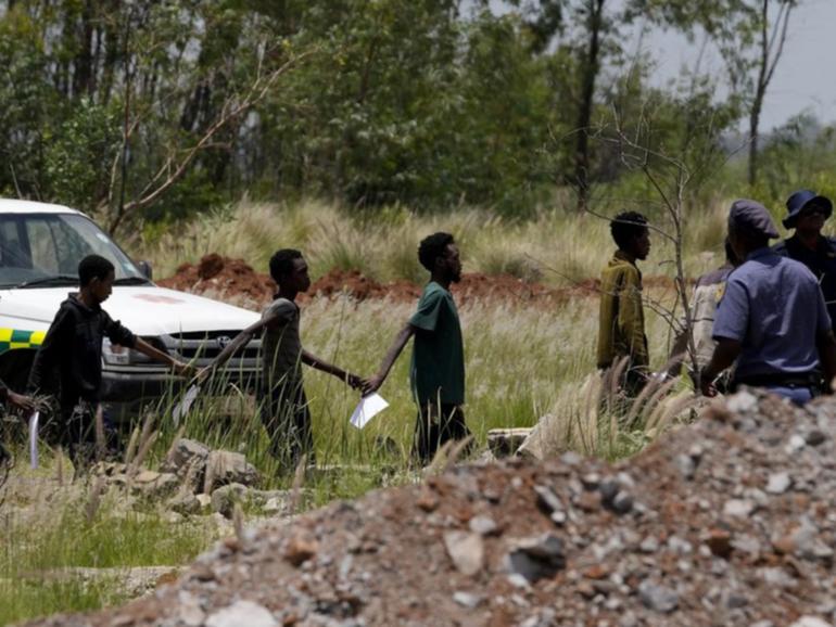 Miners, some of them emaciated and disorientated, have been brought to the surface and arrested.