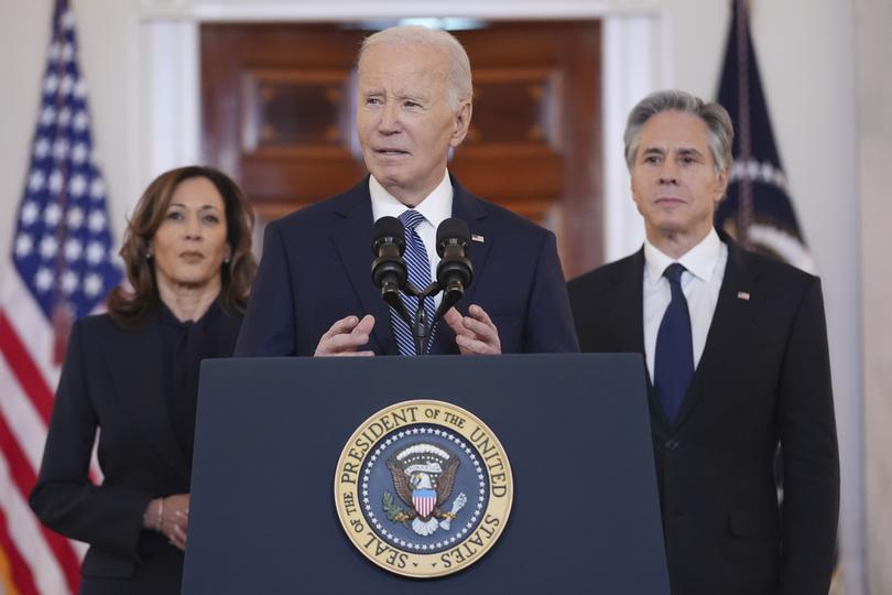 President Joe Biden, centre, with Vice President Kamala Harris, left, and Secretary of State Anthony Blinken, right, speaks in the Cross Hall of the White House on the announcement of a ceasefire deal.