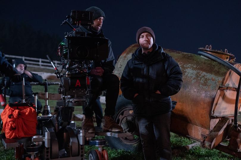 Wolf Man director Leigh Whannell (right) on set in New Zealand.