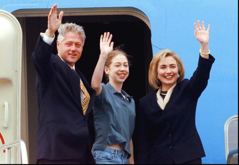 President Bill Clinton, daughter Chelsea Clinton, and first lady Hillary Rodham Clinton wave to supporters Wednesday, Nov. 6, 1996.