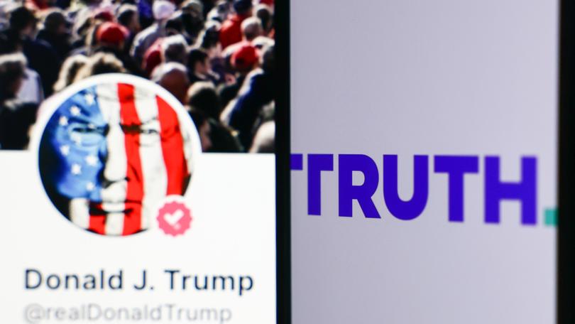 Donald Trump account on Truth displayed on a laptop screen and Truth logo displayed on a phone screen are seen in this illustration photo taken in Krakow, Poland on January 2, 2025. 