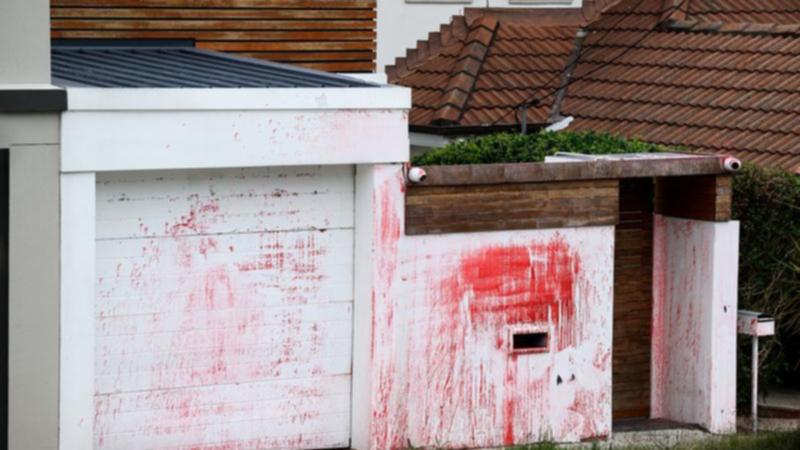 A home where a Jewish community leader had lived was defaced with anti-Semitic slurs.