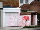 A home where a Jewish community leader had lived was defaced with anti-Semitic slurs.