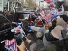 Supporters of impeached South Korean President Yoon Suk-yeol have swarmed his motorcade. 