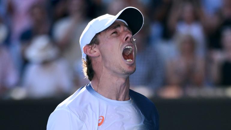 Alex de Minaur has survived a huge scare to keep his Australian Open dream alive and etch his name in the tennis history books.