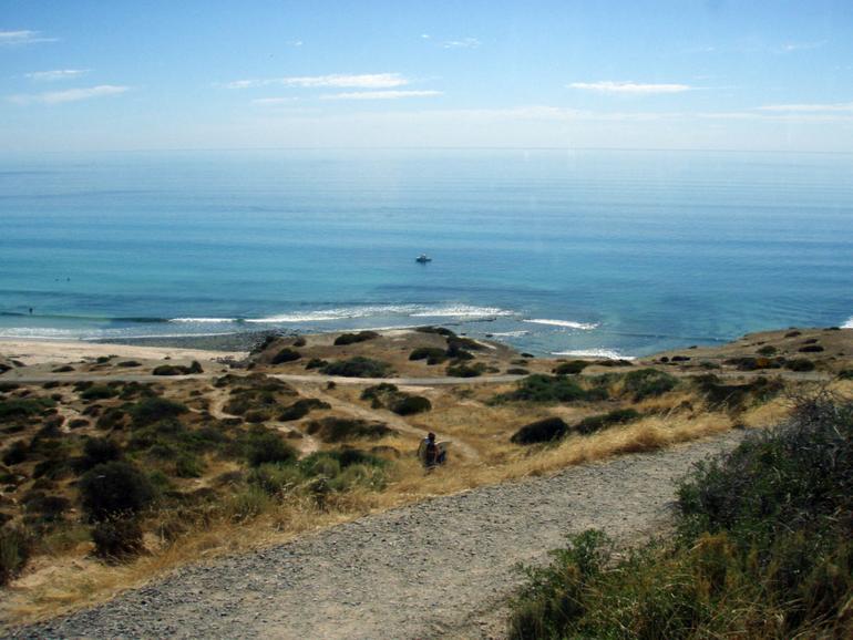 Maslin Beach, south of Adelaide, is the focus point for a search after a car went over a cliff.