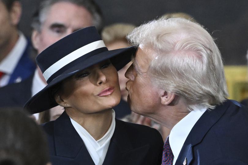 President-elect Donald Trump kisses Melania Trump before the 60th Presidential Inauguration in the Rotunda of the U.S. Capitol in Washington, Monday, Jan. 20, 2025. (Saul Loeb/Pool photo via AP)