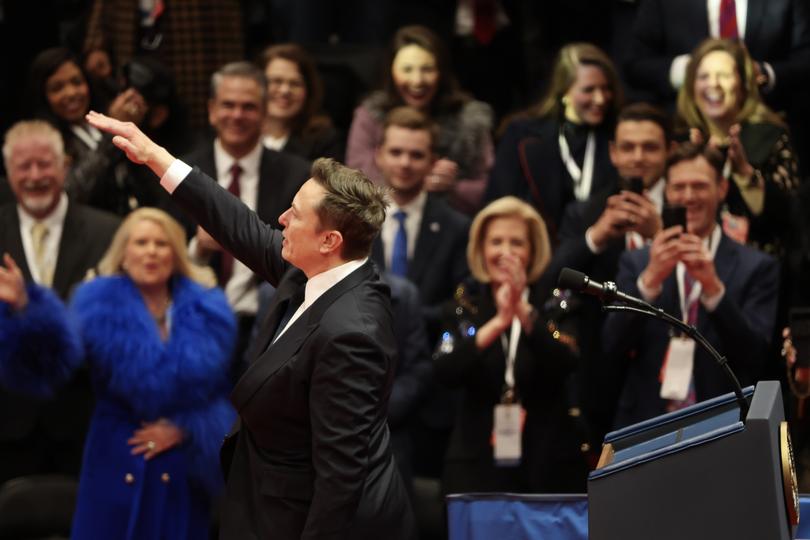 Tesla, SpaceX and X CEO Elon Musk gestures while speaking during an inauguration event at Capital One Arena .