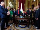 Newly sworn-in President Donald Trump (C) takes part in a signing ceremony in the President's Room following the 60th inaugural ceremony at the US Capitol in Washington, DC.