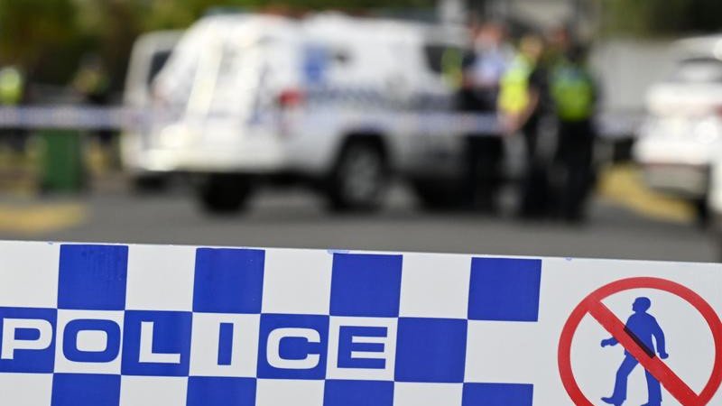 A man hunt is underway after a woman was found dead on a suburban Queensland street.