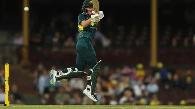 Beth Mooney was airborne in belting 75 to set Australia up for its Ashes-clinching win over England. (Mark Evans/AAP PHOTOS)