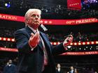 US President Donald Trump throws pens to the crowd after signing executive orders during the inaugural parade inside Capital One Arena.