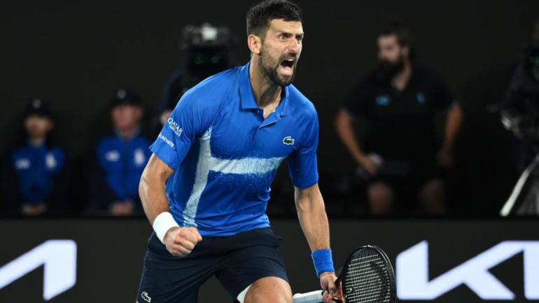 Novak Djokovic roars as he celebrates winning match-point in the quarter-final with Carlos Alcaraz.