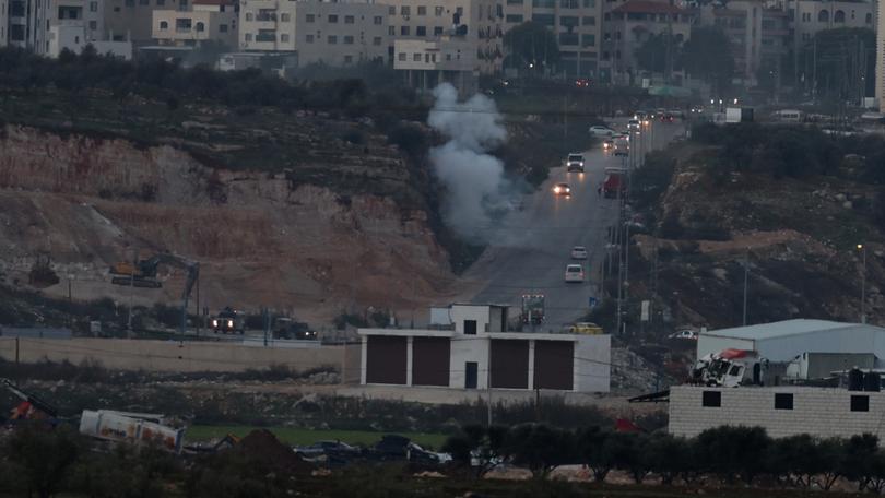 Smoke rises during clashes with Israeli forces near the checkpoint of Bet Forik at the entrance of Nablus, West Bank.