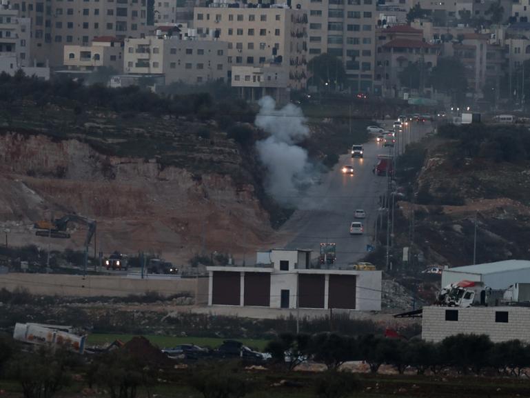 Smoke rises during clashes with Israeli forces near the checkpoint of Bet Forik at the entrance of Nablus, West Bank.