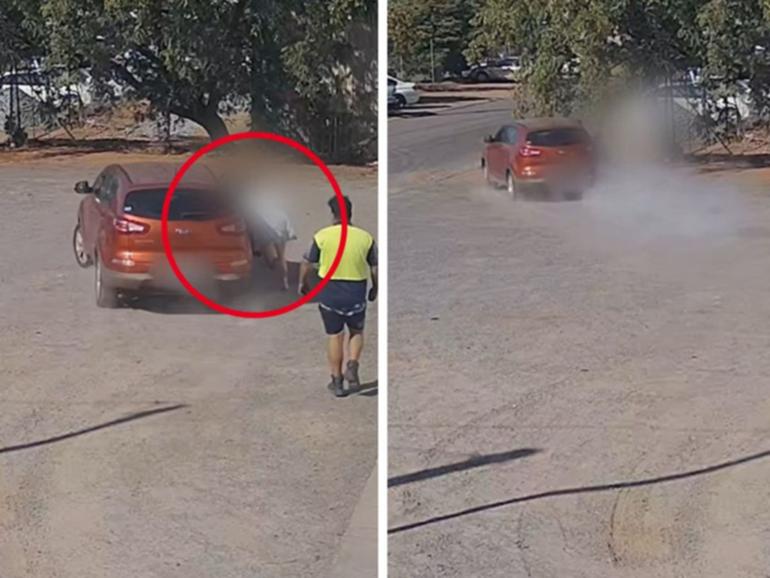 A womanclung to a car with a child inside as it was stolen in Kalgoorlie-Boulder on Wednesday.