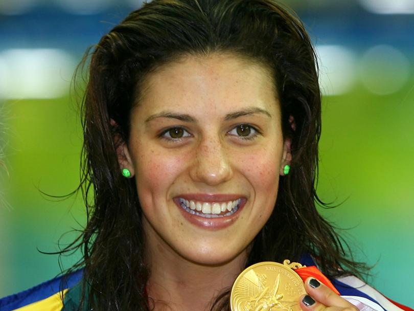 Stephanie Rice poses with the gold medal during the medal ceremony for the Women's 400m Individual Medley event at the Beijing 2008 Olympic Games.