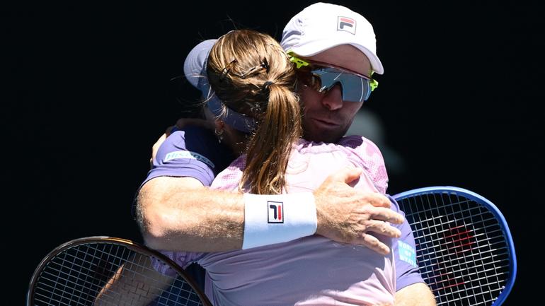 Olivia Gadecki and John Peers celebrate winning the Australian Open mixed doubles crown. 