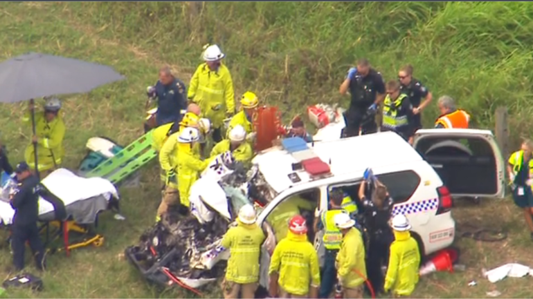 An officer has been trapped after a police car and a truck collided on Queensland’s Cunningham Hwy.