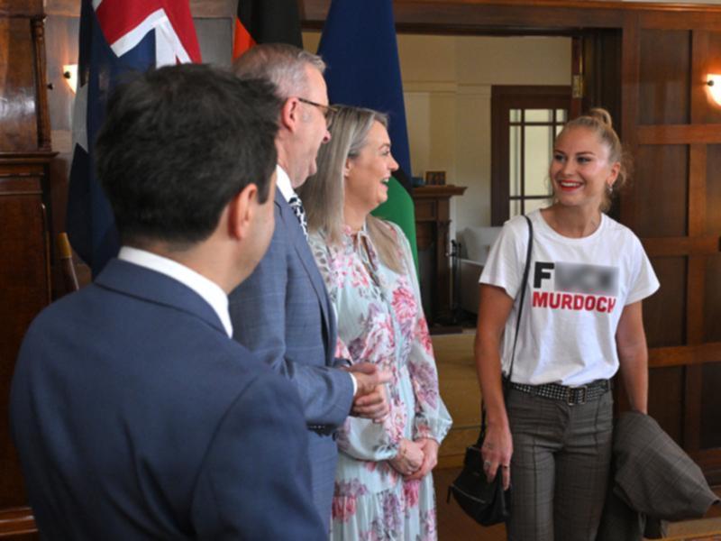 Grace Tame wore a provocative T-shirt when meeting the PM at an Australian of the Year event. (Mick Tsikas/AAP PHOTOS)