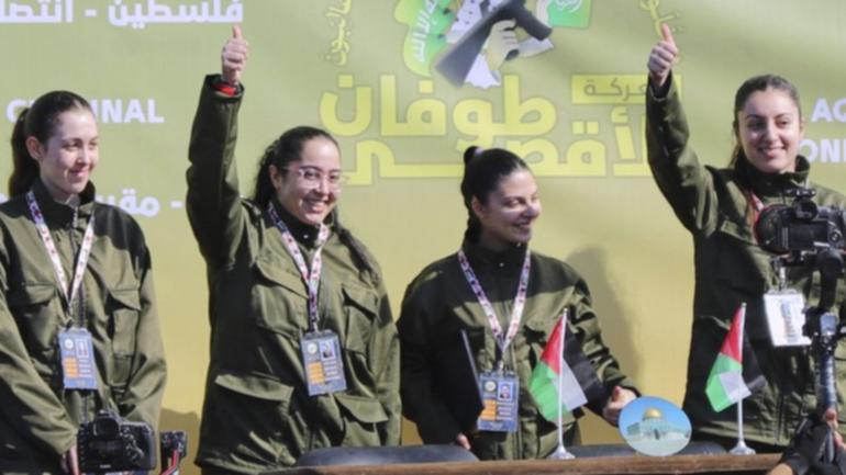 The four female Israeli soldiers were paraded in front of a crowd by Hamas militants before being shepherded into Red Cross vehicles.