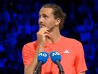 Alexander Zverev looks up to hear abuse from a fan in the crowd.