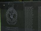 The words 'evil' and 'dogs' have been etched onto a police memorial wall along the names of fallen members of the force.