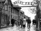 Concentration camp victims are led through the Auschwitz-Birkenau camp gate in 1945 in this photo found recently in Moscow. 