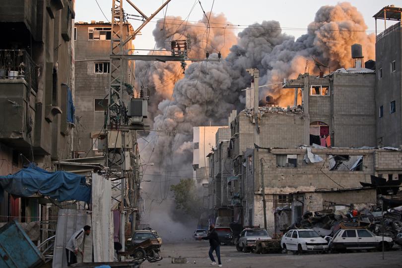 Smoke rises from a building destroyed in an Israeli airstrike at the Bureij camp for Palestinian refugees in the central Gaza Strip on January 12, 2025.