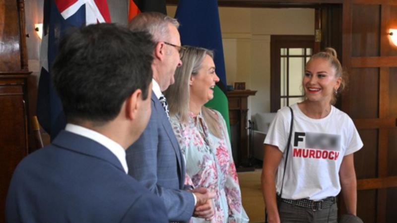 Grace Tame wore a provocative T-shirt when meeting the PM at an Australian of the Year event. 