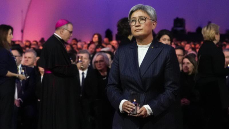 Foreign Minister Penny Wong was one of many international leaders to light a candle at Auschwitz.