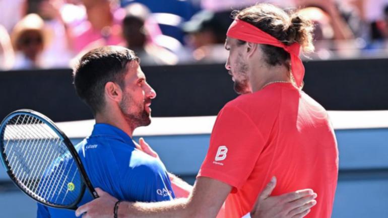 Alexander Zverev (R) consoles Novak Djokovic after the Serb's Australian Open semi-final retirement.