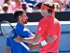 Alexander Zverev (R) consoles Novak Djokovic after the Serb's Australian Open semi-final retirement.