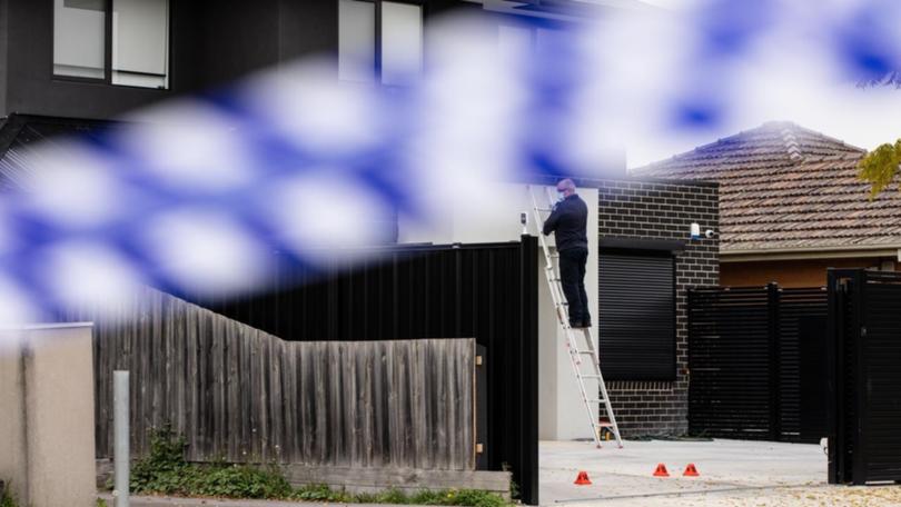 Armed crime squad members comb Sam Abdulrahim's Melbourne property after he was lured out the front and had 17 shots fired at him in May 2024.