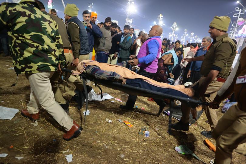 A deceased attendee is carried away after a stampede before the 'Amrit Snan' at the Kumbh Mela on January 29, 2025 in Allahabad, India. 