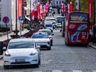 Oslo Taxi’s Tesla model Y (L) and the NIO ET5 electric vehicle from Nio Inc, a Chinese multinational electric car manufacturer, drive through the Norwegian capital Oslo, on September 27, 2024.