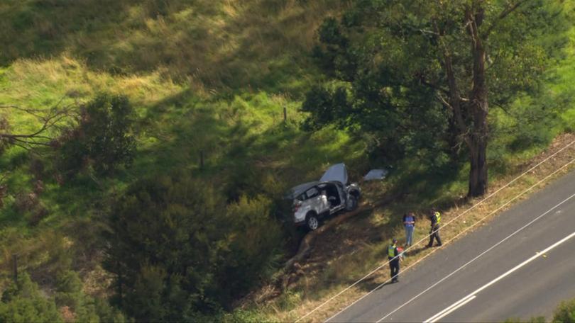 The impact caused the car to veer off the road and land on an angle.