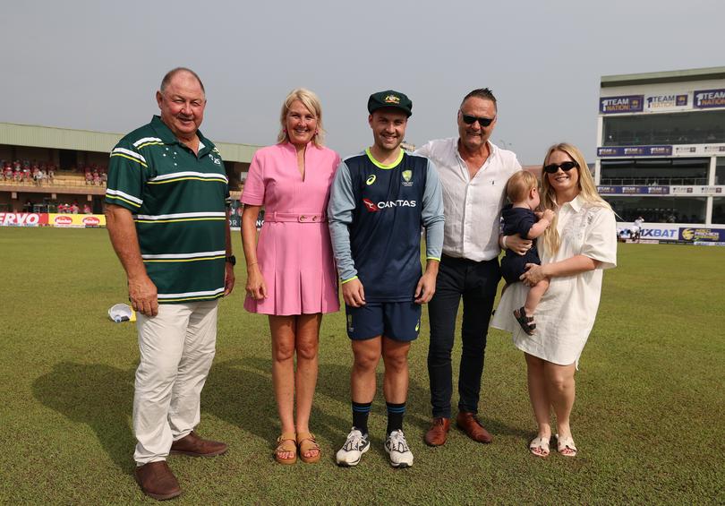 GALLE, SRI LANKA - JANUARY 29: Josh Inglis of Australia is seen with Geoff Marsh (R) and his parents Martin and Sarah along with his wife and child Megan and Oscar after he received his cap during day one of the First Test match in the series between Sri Lanka and Australia at Galle International Stadium on January 29, 2025 in Galle, Sri Lanka.  (Photo by Robert Cianflone/Getty Images)