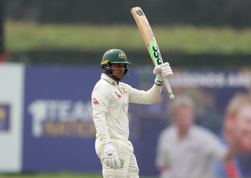 GALLE, SRI LANKA - JANUARY 30: Usman Khawaja of Australia raises his bat after reaching 150 runs during day two of the First Test match in the series between Sri Lanka and Australia at Galle International Stadium on January 30, 2025 in Galle, Sri Lanka.  (Photo by Robert Cianflone/Getty Images)