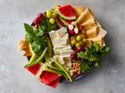 Naan-o Paneer-o Sabzi in New York in July 2021. Each element — feta, basil, mint, cucumbers and watermelon, to name a few — is thoughtfully arranged and delightfully cooling. Food styled by Lish Steiling. (Bryan Gardner/The New York Times)