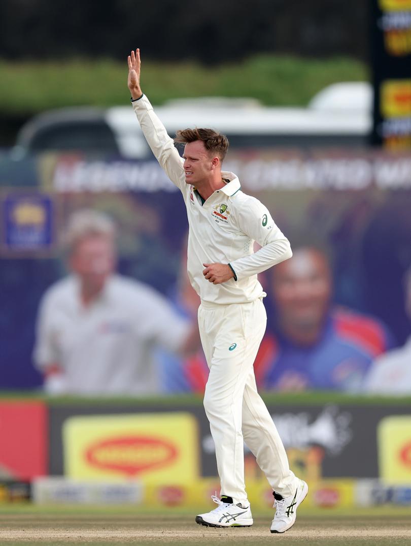 Matthew Kuhnemann of Australia takes the wicket of Oshada Fernando of Sri Lanka.