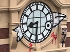 Police will allege the man scaled and defaced heritage-listed Flinders St Railway Station clock. (HANDOUT/METRO)