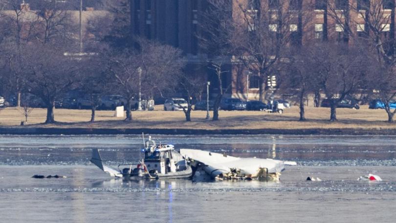 All 67 occupants of the plane and helicopter which collided near Washington DC are feared dead. (EPA PHOTO)