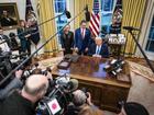 President Donald Trump speaks with Interior Secretary Doug Burgum and his wife Kathryn in the Oval Office at the White House on Friday.  MUST CREDIT: Jabin Botsford/The Washington Post