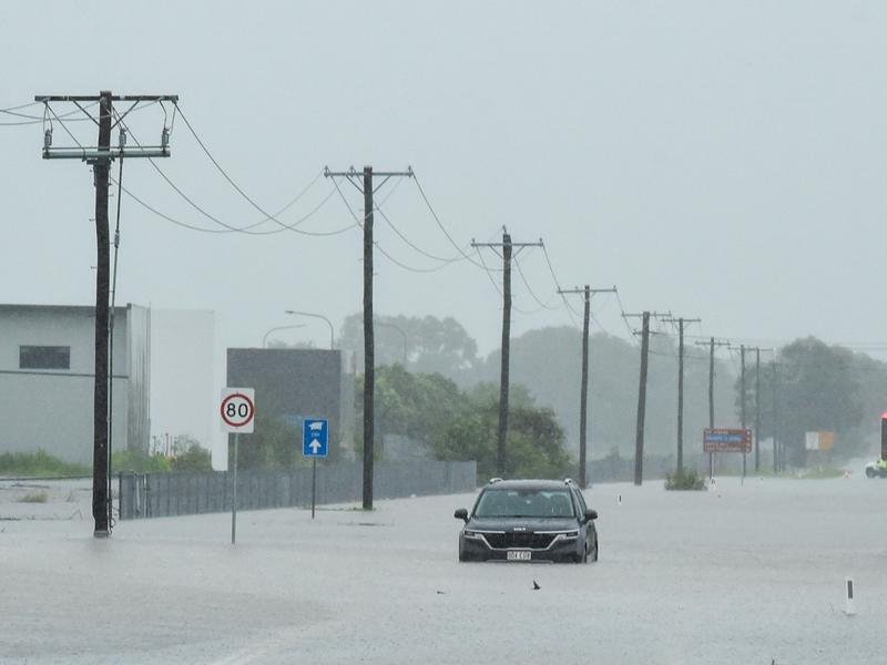 North Queensland has been hit by torrential rain resulting in road closures and flooding. (Scott Radford-Chisholm/AAP PHOTOS)